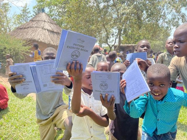 Children receiving school supplies